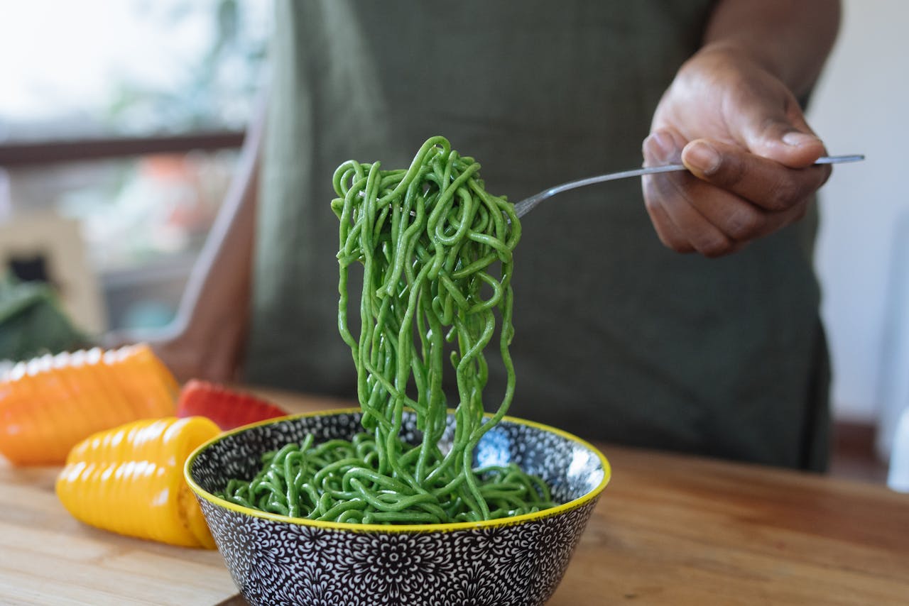 green noodles on fork